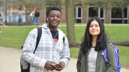 Male and female students smiling