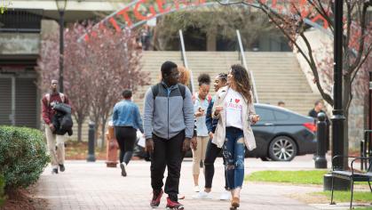 David Asafn Adjaye SPAA'21 and Amaly Garcia SPAA'20 walk to class at Rutgers–Newark campus